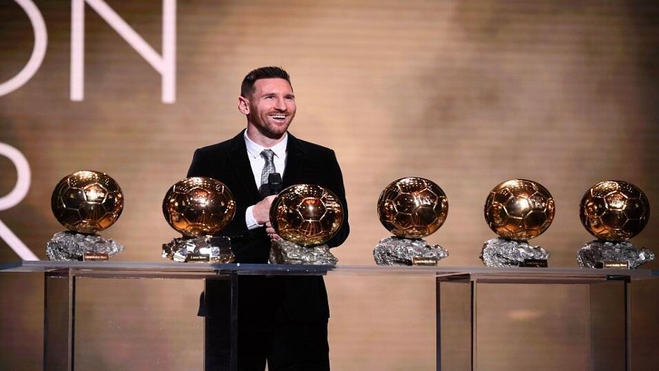 Lionel Messi with the Ballon d'Or